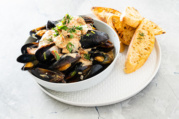 Mussels with herbs in a bowl