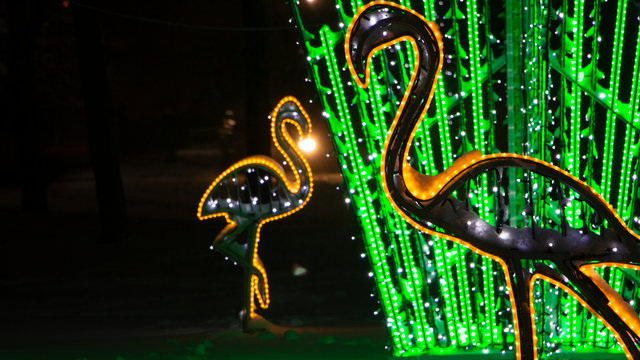 Neon lights in a winter public park. In the form of various animals. - Powered by Adobe