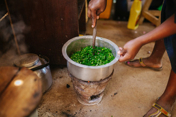 african woman cooking in Uganda