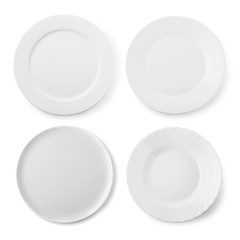 Set of empty white ceramic plates, top view of isolated objects