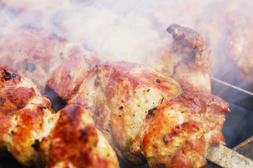 Skewers in the process of cooking close-up