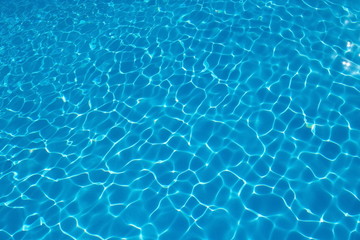  Rippled pattern of blue clean water in a  swimming pool.