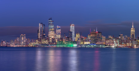 Fototapeta na wymiar Midtown Manhattan Panoramic view at night from Hudson river with long exposure