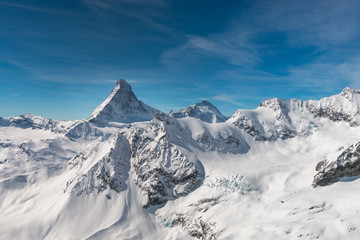 Fototapeta na wymiar Aerial view of majestic Matterhorn mountain in front of a blue sky