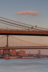 View on Brooklyn and Manhattan bridges  from east river at sunset  with long exposure 