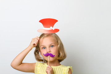 Free time for fun. Close up portrait small girl with fake mustache with plump