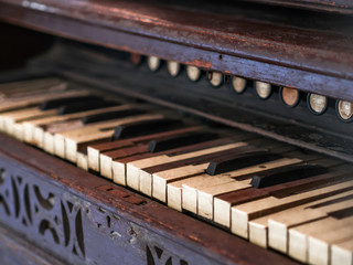 Fototapeta na wymiar a historic old wooden piano keys and weathered wood keys
