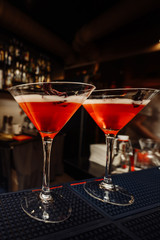 Ready red cocktail in a glass at the bar.