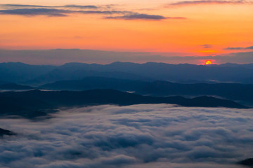 Fototapeta na wymiar sunset overlooking mountains with Mist