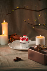 Fototapeta na wymiar Christmas sweets: cupcakes closeup on a linen background.