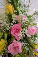 bouquet of roses in vase on a white background