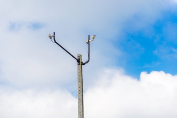 cctv camera on pole with blue sky