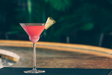 Cosmopolitan cocktail at the bar stand. Luxury vacation concept