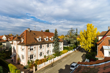 Little autumnal colorful street in Strasbourg aerial view, sunny and fresh