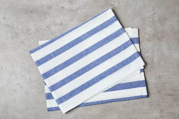 Rucksack Striped fabric napkins on gray background, top view © New Africa