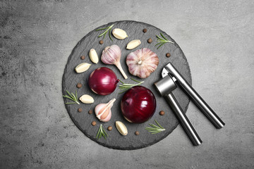 Flat lay composition with garlic and onion on table