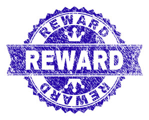 REWARD rosette stamp seal watermark with grunge style. Designed with round rosette, ribbon and small crowns. Blue vector rubber watermark of REWARD text with dust texture.