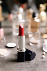 Bright lipstick on dressing table. Decorative cosmetics