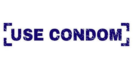 USE CONDOM text seal print with grunge texture. Text tag is placed between corners. Blue vector rubber print of USE CONDOM with grunge texture.