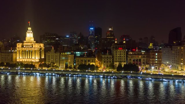 China Shanghai Aerial v41 Hyperlapse flying low over Huangpu river looking toward waterfront promenade at night 10/18