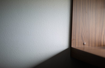Shelf With A Shadow And A Wall. 