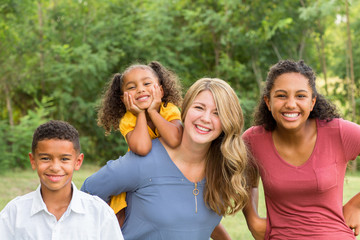 Portarit of a happy mixed race family smiling