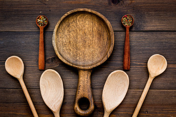 Village wooden cutlery set on wooden background top view