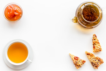 Tea with homemade cookies. Fresh cookies, cup of tea, teapot on white background top view space for text