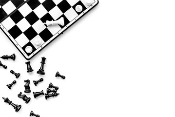 Symbol of competition. Chess board and chess figures on white background top view copy space