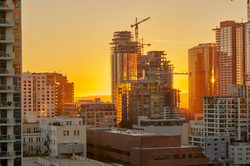 Sunset over Los Angeles California showing construction of skyscrapers