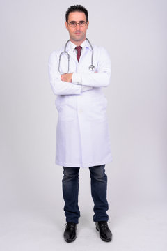 Full Body Shot Of Handsome Man Doctor Against White Background