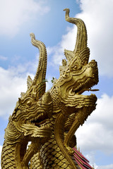 Fototapeta na wymiar Thai dragon or serpent statue In Thai temple on sunshine background, Thailand