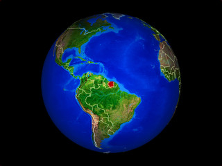 Suriname on planet planet Earth with country borders. Extremely detailed planet surface.