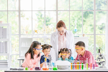 Teacher and students in lab, smoke float out..