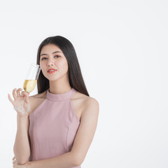 Confident woman posing with champagne glass.