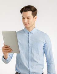 Happy business man using tablet.