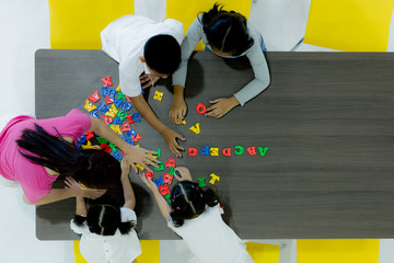 Kids playing colorful toys.