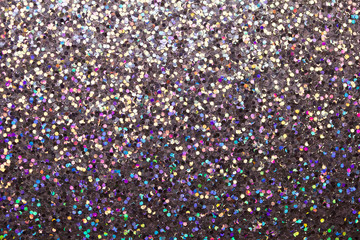 Colorful macro abstract background of glitter confetti in shades of blue and pink
