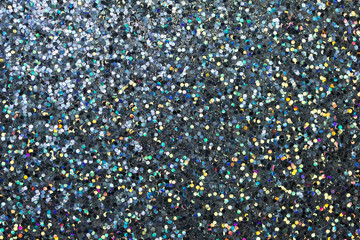 Colorful macro abstract background of glitter confetti in shades of blue