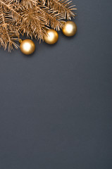 Creative decoration pattern with golden Christmas tree branches and baubles. Concept