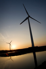 Fototapeta na wymiar Wind Turbine in the sunset seen from an aerial view