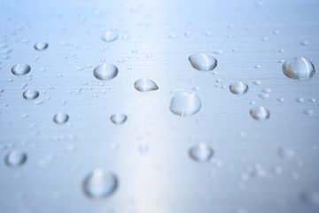 Water Drops On Blue Background.