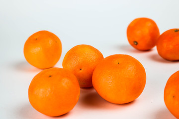 Tangerines on white.
