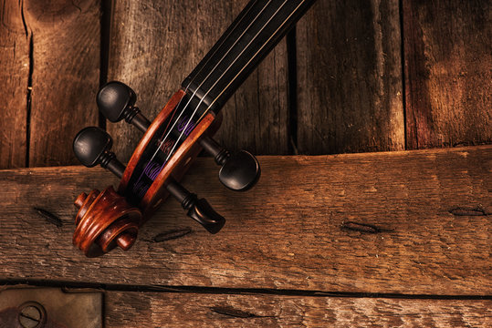 old violin on a wood background