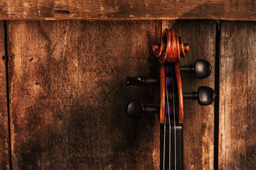 violin scroll on wood background horizontal with copy space