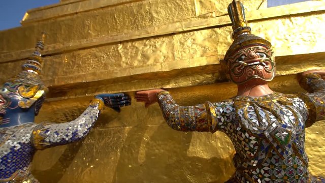 Ancient Thai statue at The Grand Palace Temple in Bangkok, Thailand. Slow motion