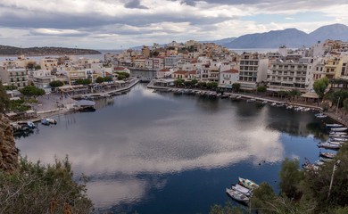 Fototapeta na wymiar Nikolaos Greece, 12-18-2018. Old Agios Nikolaos harbor in Crete Greece.
