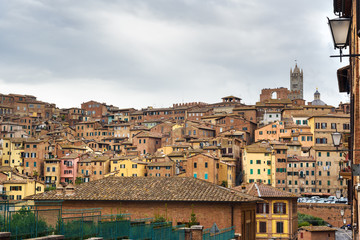 Fototapeta na wymiar View on Siena city from street Via del Sole. Italy