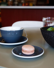 macaroons on a plate in a coffee shop