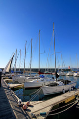 Fototapeta premium Scenery of yacht harbor facing calm sea of summer